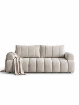 sofa-bezowa-kanalowa-z-pledem.webp